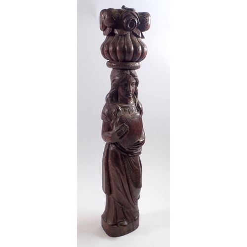 820 - An antique continental carved wood pilasta figure of a woman holding heart, 47cm tall