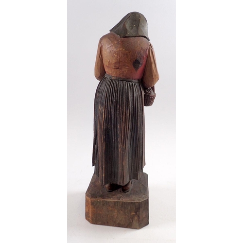 822 - A Black Forest carved figure of a woman 35cm tall