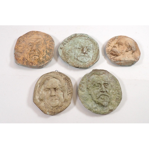 826 - A set of five plaster cast circular wall plaques of classical men