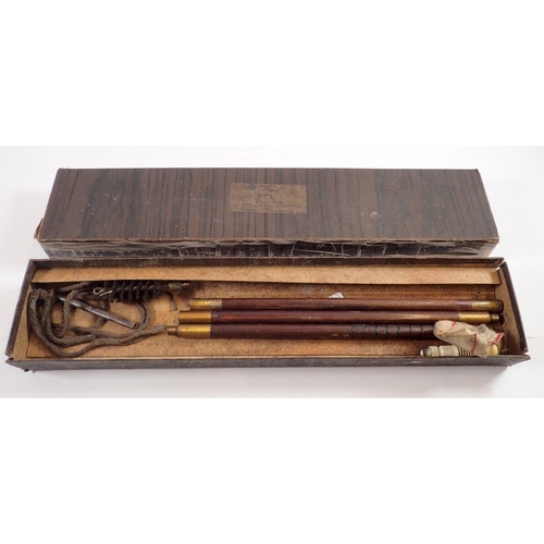 832 - A gun cleaning kit, boxed 44cm long