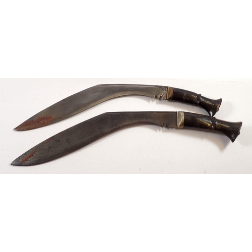 844 - Two horn handled Gurkha kukri knives in leather sheaths, one with two smaller knives, one missing a ... 