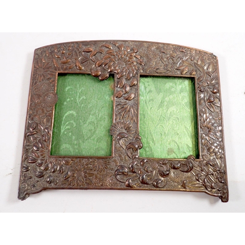 847 - A Japanese cast double photograph frame 18 x 22cm and another oval double frame