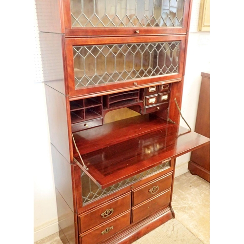 855 - A mahogany Globe Wernicke style bookcase with secretaire, four drawers and lead glazed panels