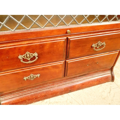 855 - A mahogany Globe Wernicke style bookcase with secretaire, four drawers and lead glazed panels