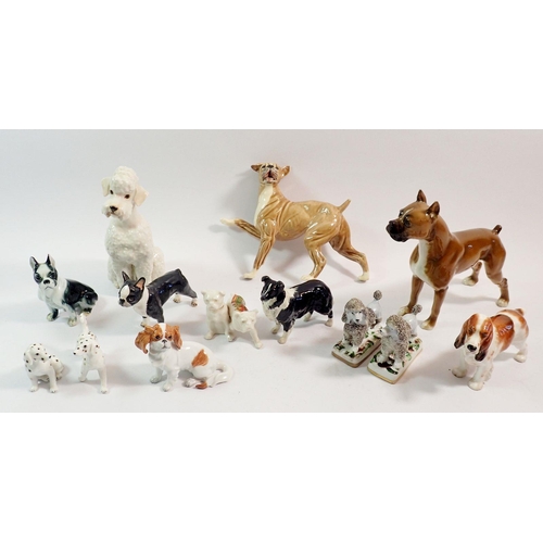 86 - A collection of dog ornaments to include Poodles, Boxer, Dalmatians etc.