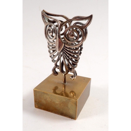 865 - An Ilias Lalaounis silver plated owl paperweight on brass stand, 8cm tall