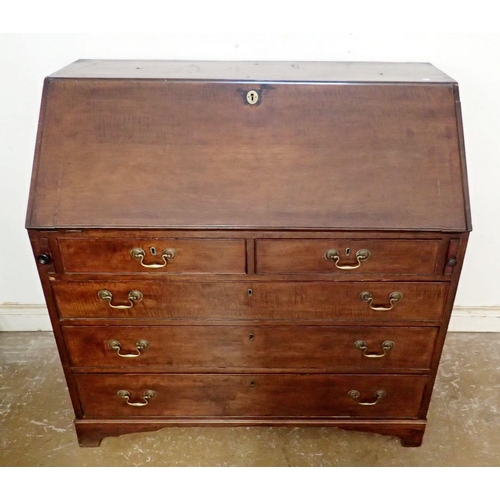 873 - A Georgian mahogany bureau with slope front and fitted interior over two short and three long drawer... 