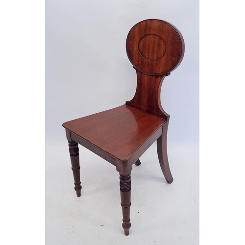 880 - A Victorian mahogany hall chair with rectangular panel back and turned supports