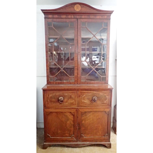 885 - An early 19th century mahogany secretaire bookcase, the arch to inlaid cornice over pair of astragal... 