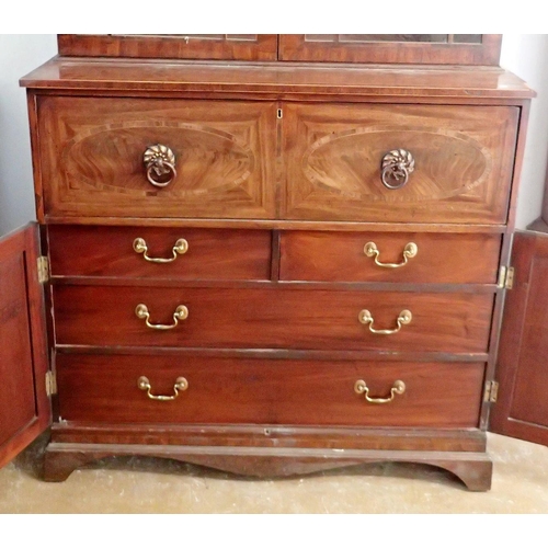 885 - An early 19th century mahogany secretaire bookcase, the arch to inlaid cornice over pair of astragal... 