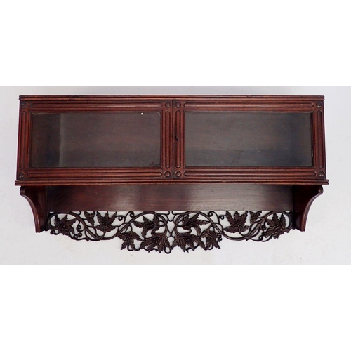 890 - A 19th century rosewood bookcase top with carved leaf surmount over pair of glazed doors, 102cm wide... 