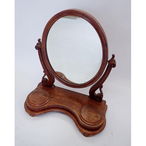 899 - A Victorian oval toiletry mirror on shaped base, height 64cm