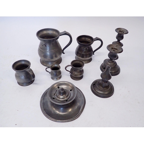 908 - A box of pewter tankards, candlesticks and inkwell