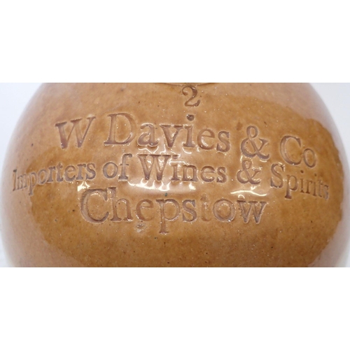 909 - A large stoneware wine flagon for David & Co