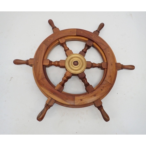 913 - A wooden ships wheel, 61cm wide