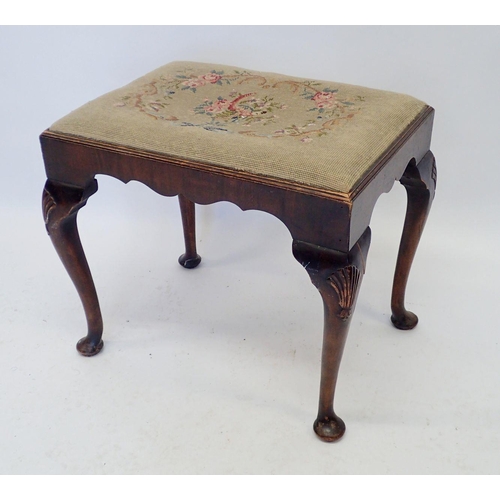 923 - A dressing table stool with shell carved cabriole supports