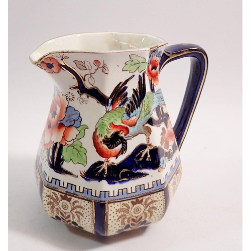 93 - An Edwardian jug decorated exotic bird and flowers, 15cm tall