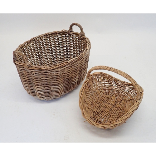 931 - A wicker log basket, 55cm across and wicker shopping basket, 46cm