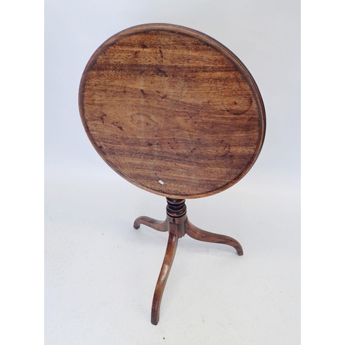 937 - A Georgian mahogany tilt top occasional table on down turned supports, 53cm diameter