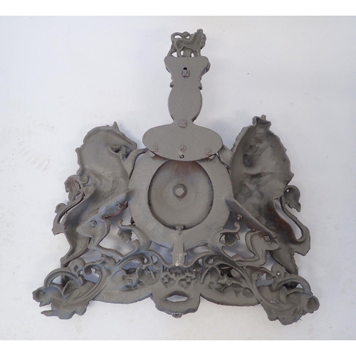 942 - A large cast iron over lintel Royal heraldic crest with lion and unicorn, now painted grey 58 x 55cm