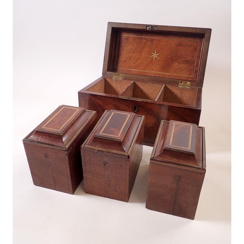 945 - A George III mahogany tea caddy with bone finial and three interior caddies, 24cm wide