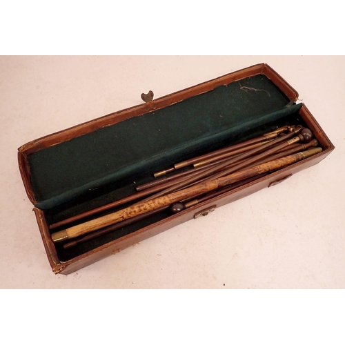 957 - An antique gun cleaning kit in leather case