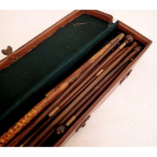 957 - An antique gun cleaning kit in leather case