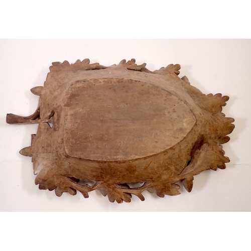 965 - A 19th century Black Forest carved wooden leaf form nut bowl with oak and acorn border, 39 x 26cm