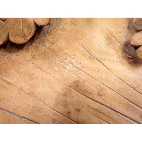 965 - A 19th century Black Forest carved wooden leaf form nut bowl with oak and acorn border, 39 x 26cm