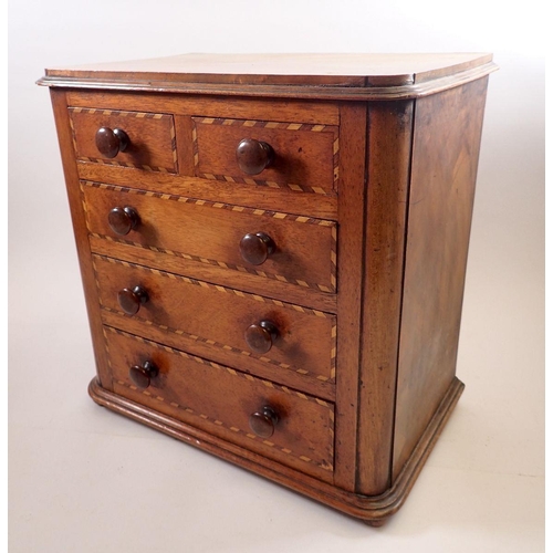 966 - A Victorian mahogany apprentice piece miniature chest of drawers with satinwood and rosewood banding... 