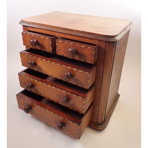 966 - A Victorian mahogany apprentice piece miniature chest of drawers with satinwood and rosewood banding... 