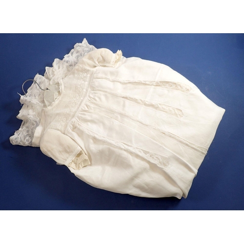 978 - A silk christening gown with inset lace panels