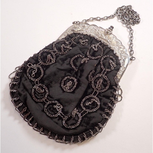 981 - A Victorian evening bag with silver plated clasp decorated horse racing scenes and jockeys