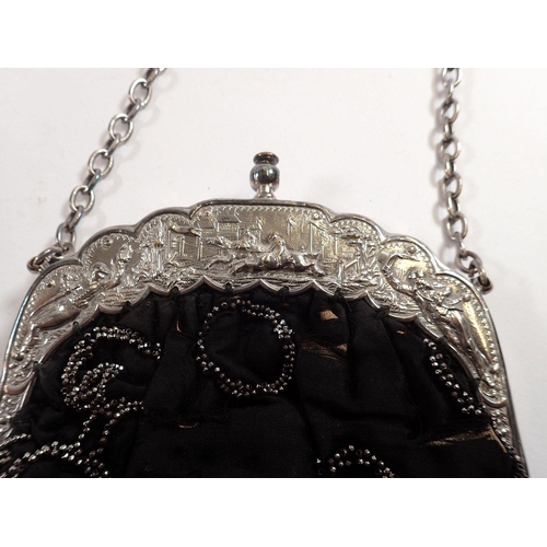 981 - A Victorian evening bag with silver plated clasp decorated horse racing scenes and jockeys