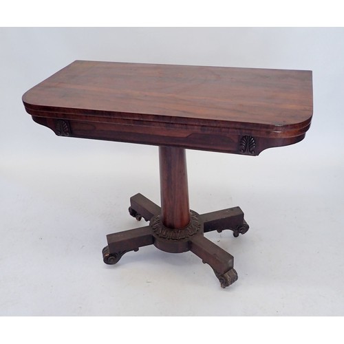 1119 - An early 19th century rosewood fold top card table on column support and quaruple base, 92cm wide