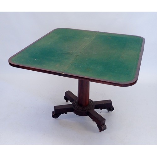 1119 - An early 19th century rosewood fold top card table on column support and quaruple base, 92cm wide