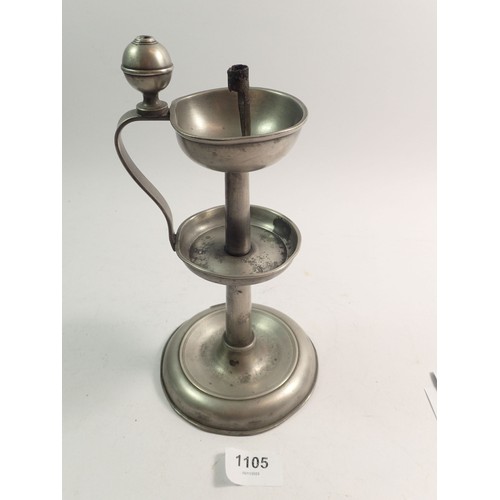 1105 - A 19th century primitive pewter oil lamp with wick holder, 23cm tall