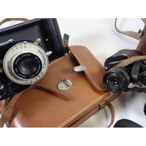 1004 - A Kodak Brownie camera, a Lieberman and Gortz pair of 8 x 25 binoculars and another pair of binocula... 