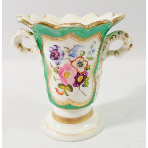 101 - A 19th century Rockingham style vase painted flowers on a green ground, 10cm