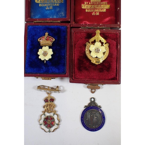 1012 - Two Primrose Society badges boxed, a sterling silver 'Ball Puncher' medal and Queen Mary's Needlewor... 