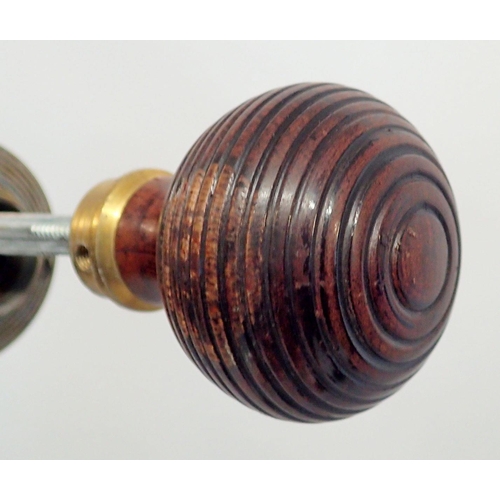 1036 - A quantity of turned wooden door knobs and vintage brass door handles