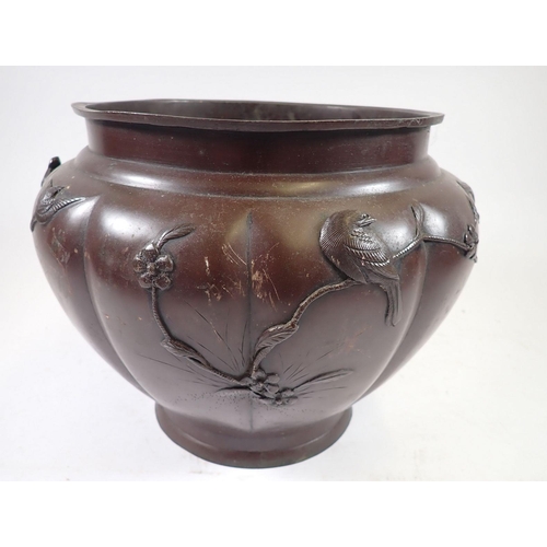 1039 - A Japanese Meiji period bronze finish jardiniere with bird and blossom decoration, 22cm tall