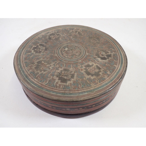 1042 - An Indian painted lacquer circular spice box, 21cm diameter