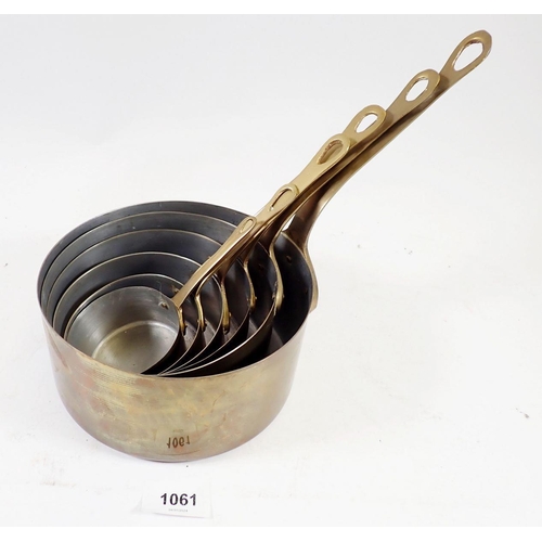 1061 - A set of six brass saucepans, largest 16cm diameter