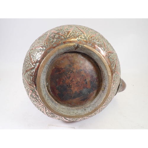 1071 - A Persian silvered copper large water carrier with spout, 23cm