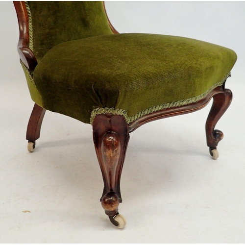 1087 - A Victorian mahogany chair with floral carved top rail and cabriole supports