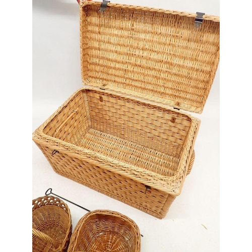 1106 - A large wicker storage chest together with two wicker baskets, chest - 83cm long x 54cm wide x 49cm ... 