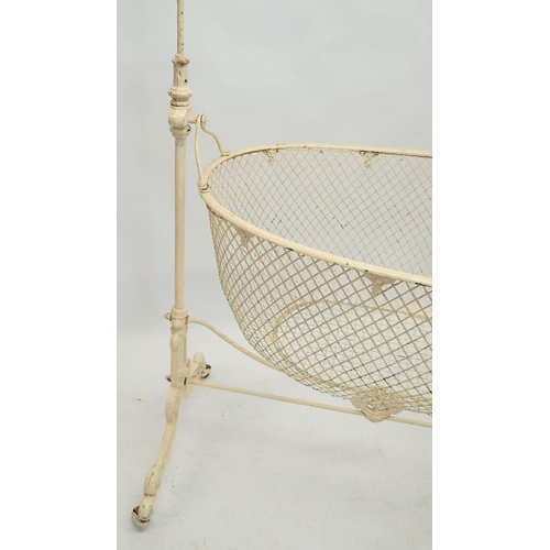 1120 - An Edwardian wrought iron rocking crib from the Homeopathic Hospital in London, 104cm long