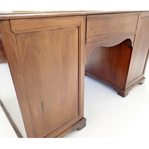 1131 - A Georgian mahogany twin pedestal desk with leather inset top over nine drawers, 129cm wide x 72cm d... 