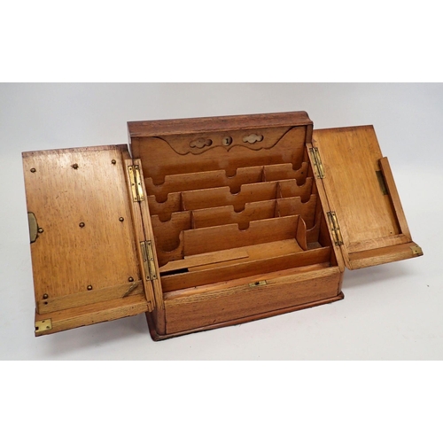 1133 - An Edwardian oak correspondence cabinet with slope front and fitted interior